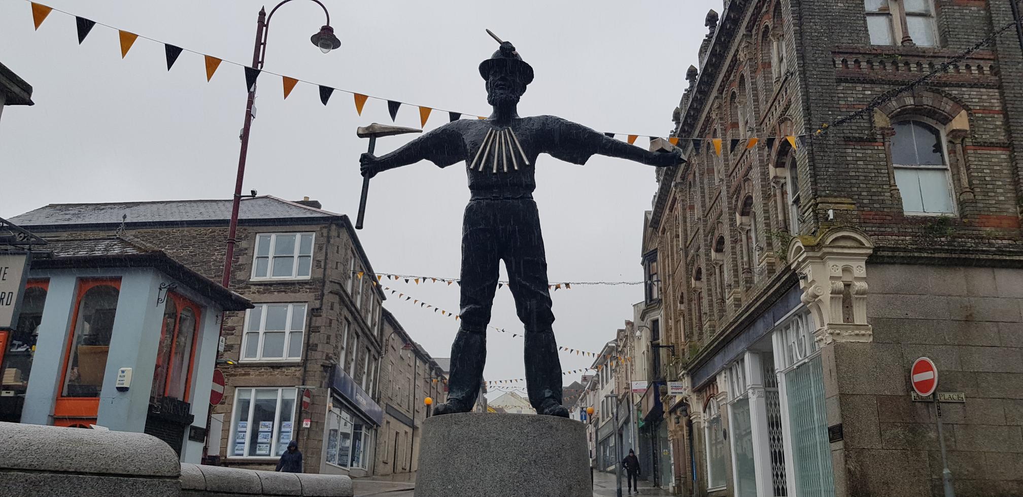 Statue of a miner in the town square of Redruth, Cornwall.